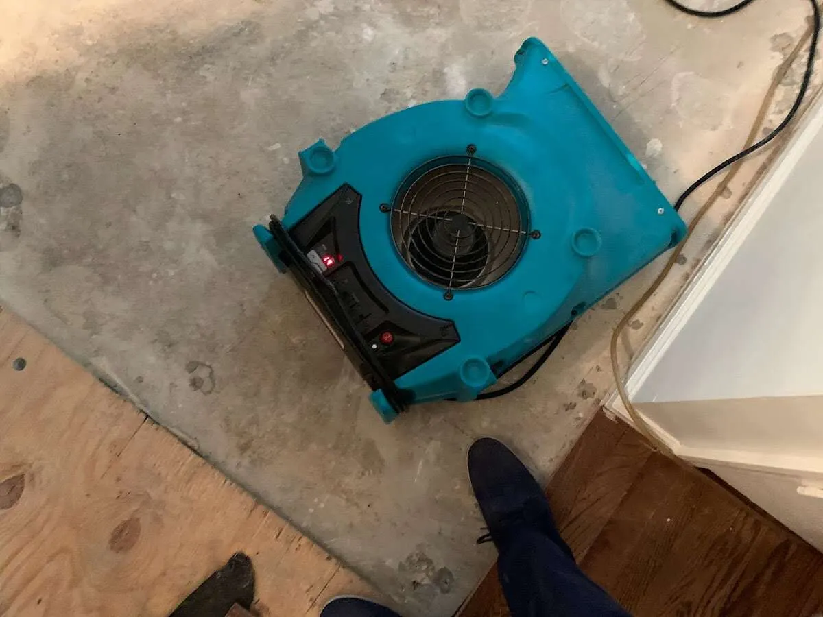 Air mover drying subfloor during Leak Detection & Repair in Reading